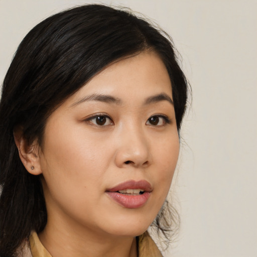 Neutral asian young-adult female with medium  brown hair and brown eyes