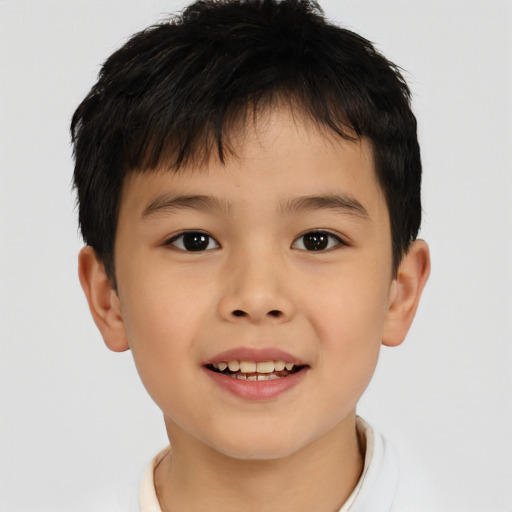 Joyful asian child male with short  brown hair and brown eyes