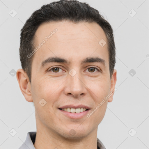 Joyful white young-adult male with short  brown hair and brown eyes