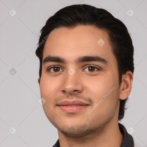 Joyful white young-adult male with short  black hair and brown eyes