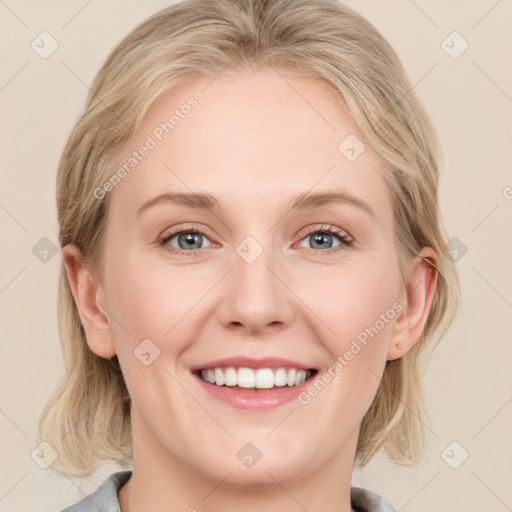 Joyful white young-adult female with medium  brown hair and blue eyes