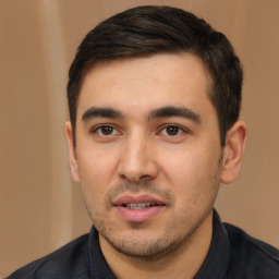 Joyful white young-adult male with short  black hair and brown eyes