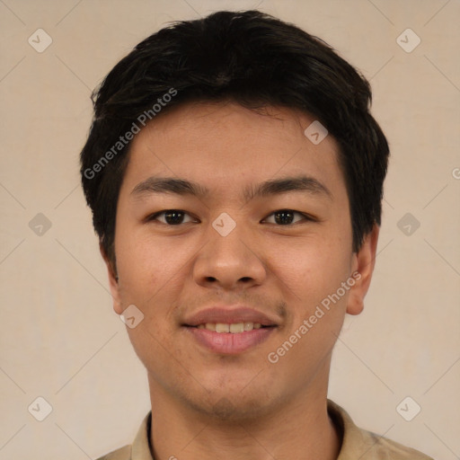 Joyful asian young-adult male with short  brown hair and brown eyes