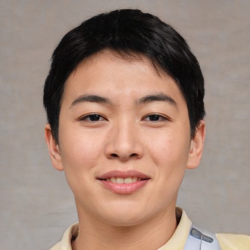 Joyful asian young-adult female with short  brown hair and brown eyes