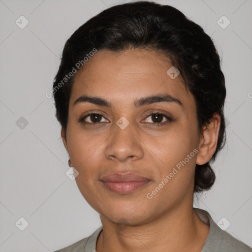 Joyful latino young-adult female with short  black hair and brown eyes