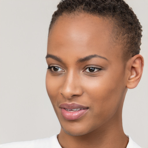 Joyful black young-adult female with short  brown hair and brown eyes