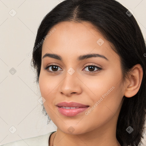 Joyful latino young-adult female with long  brown hair and brown eyes