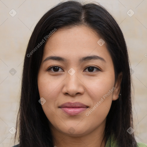 Joyful latino young-adult female with long  brown hair and brown eyes