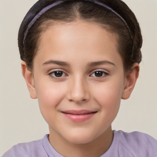 Joyful white child female with short  brown hair and brown eyes