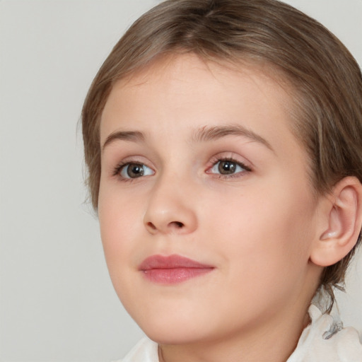 Joyful white child female with medium  brown hair and brown eyes