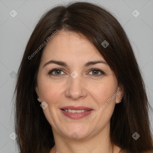 Joyful white adult female with medium  brown hair and brown eyes