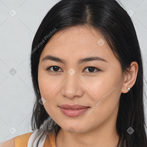 Joyful asian young-adult female with long  brown hair and brown eyes