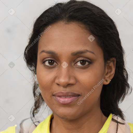 Joyful black adult female with short  brown hair and brown eyes