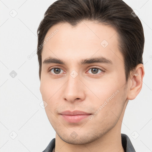 Neutral white young-adult male with short  brown hair and brown eyes