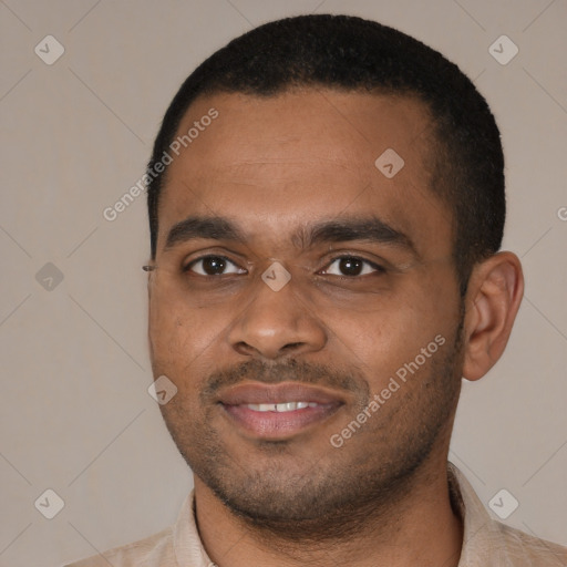 Joyful latino young-adult male with short  black hair and brown eyes