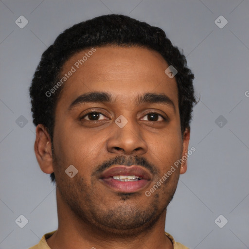 Joyful latino young-adult male with short  brown hair and brown eyes