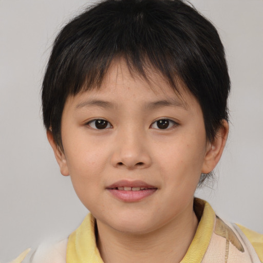 Joyful asian child female with short  brown hair and brown eyes