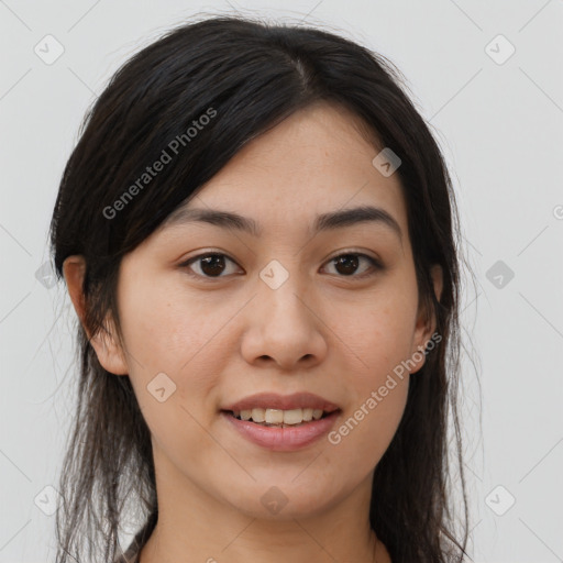 Joyful asian young-adult female with long  brown hair and brown eyes