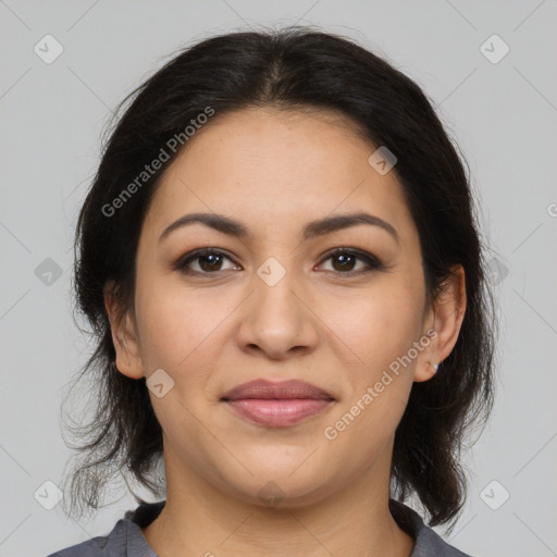 Joyful latino young-adult female with medium  brown hair and brown eyes