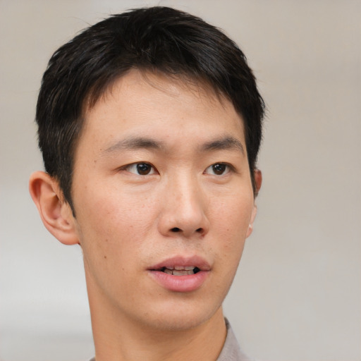 Neutral asian young-adult male with short  brown hair and brown eyes