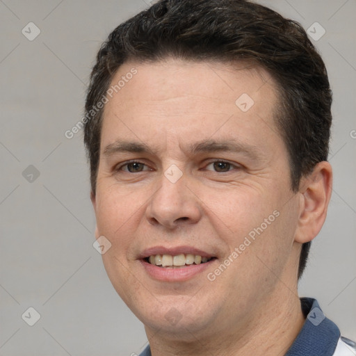 Joyful white adult male with short  brown hair and brown eyes