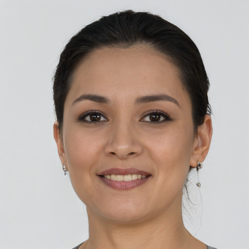 Joyful latino young-adult female with short  brown hair and brown eyes