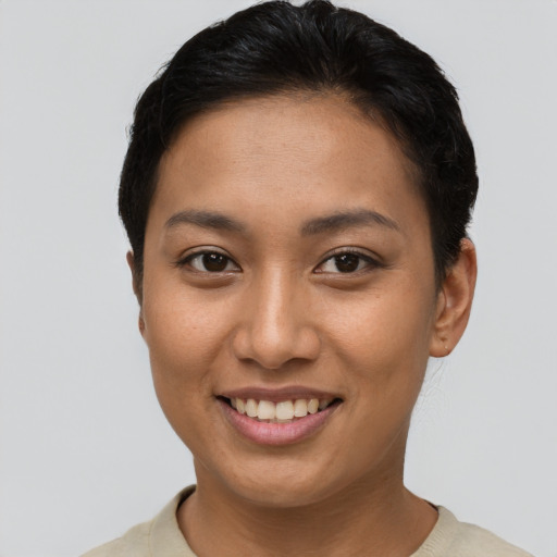 Joyful asian young-adult female with short  brown hair and brown eyes