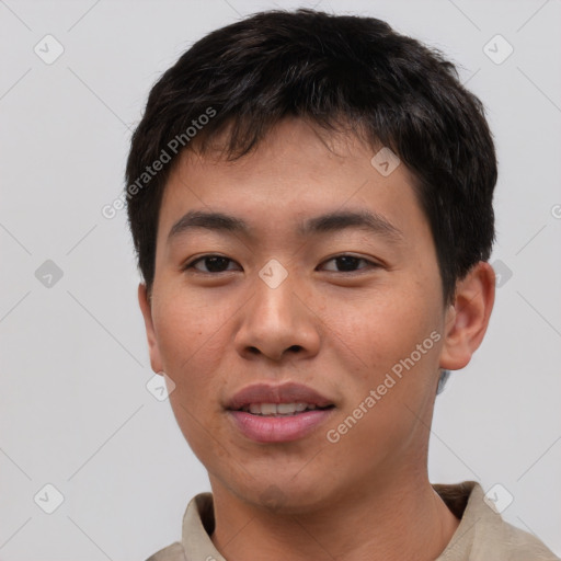 Joyful asian young-adult male with short  brown hair and brown eyes