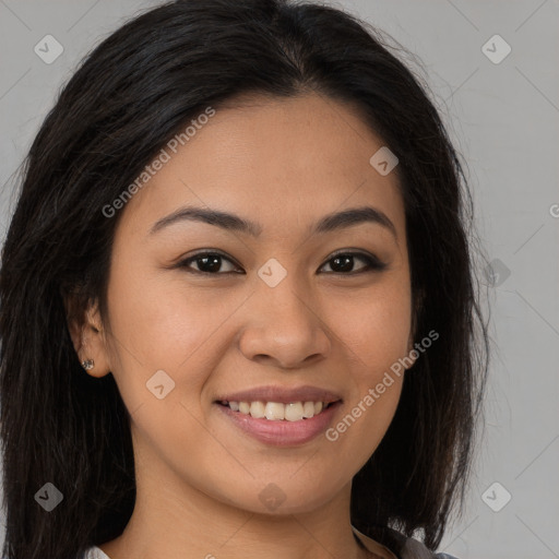 Joyful latino young-adult female with long  brown hair and brown eyes