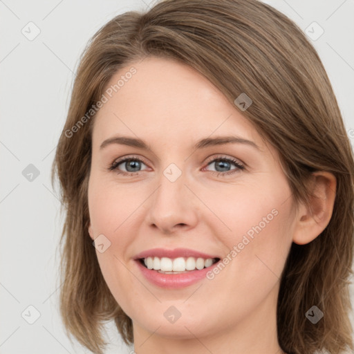 Joyful white young-adult female with medium  brown hair and green eyes