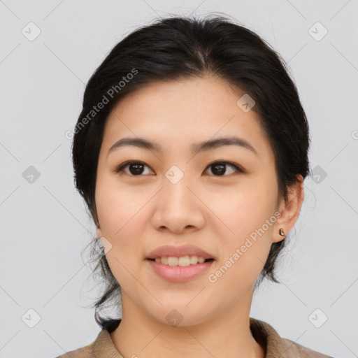 Joyful asian young-adult female with medium  black hair and brown eyes