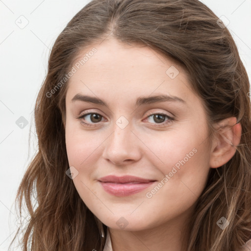 Joyful white young-adult female with long  brown hair and green eyes