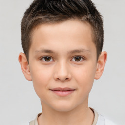 Joyful white child male with short  brown hair and brown eyes