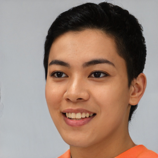 Joyful asian young-adult female with short  black hair and brown eyes