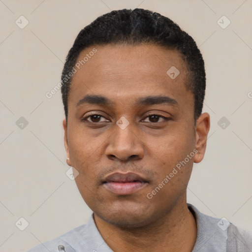 Neutral black young-adult male with short  black hair and brown eyes