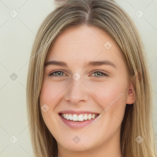 Joyful white young-adult female with long  brown hair and green eyes