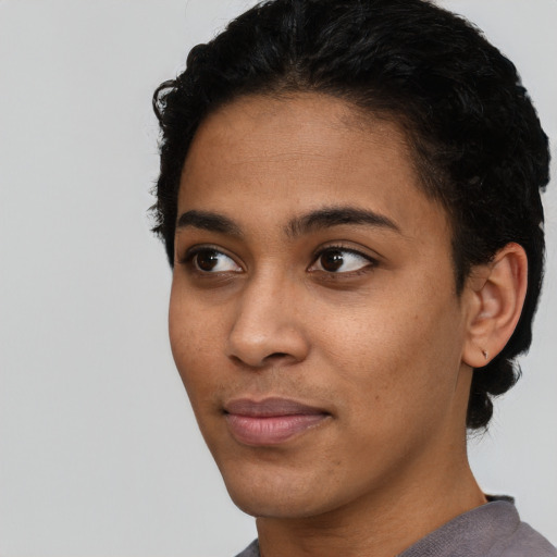 Neutral latino young-adult female with short  black hair and brown eyes