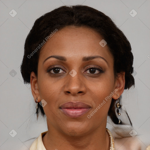 Joyful black adult female with medium  brown hair and brown eyes