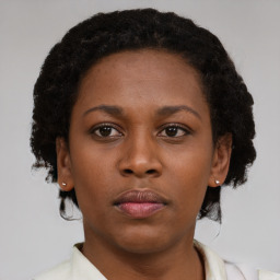 Neutral black young-adult female with short  brown hair and brown eyes