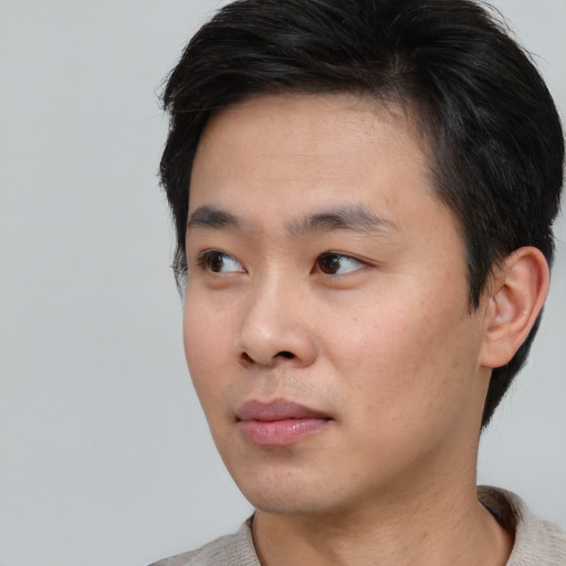 Neutral asian young-adult male with short  black hair and brown eyes