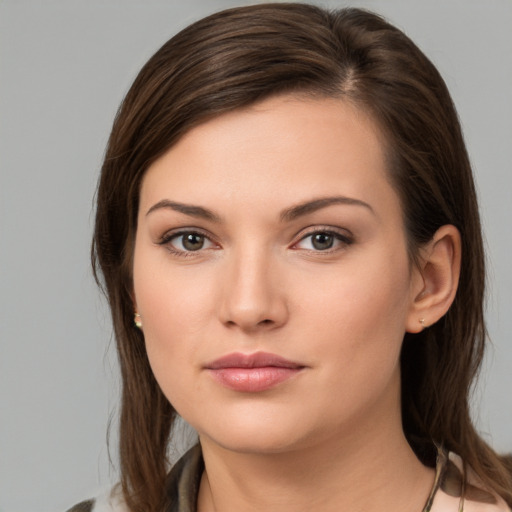 Neutral white young-adult female with medium  brown hair and brown eyes