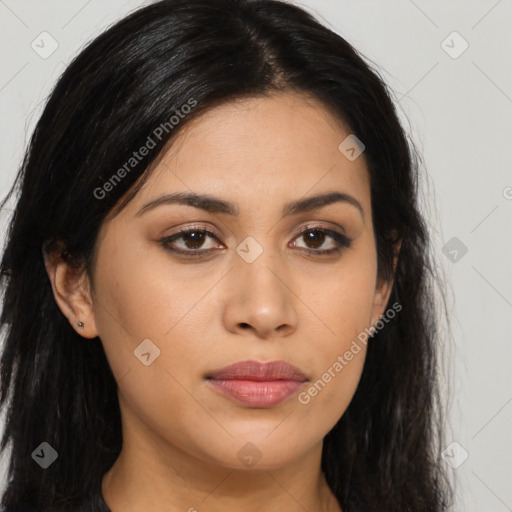 Joyful latino young-adult female with long  brown hair and brown eyes