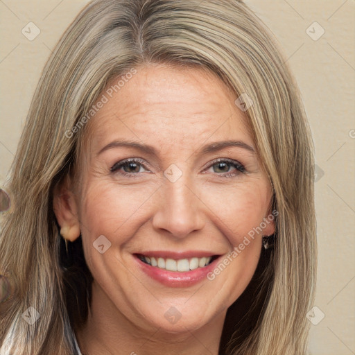 Joyful white adult female with long  brown hair and brown eyes