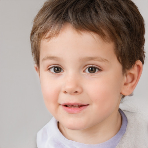 Joyful white child male with short  brown hair and brown eyes