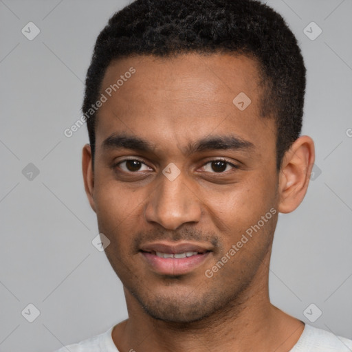 Joyful black young-adult male with short  black hair and brown eyes