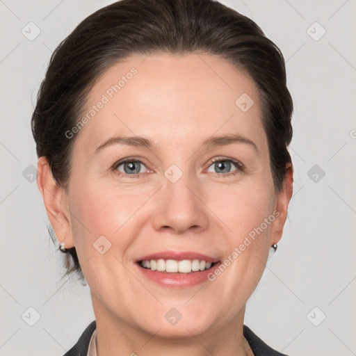 Joyful white adult female with short  brown hair and grey eyes