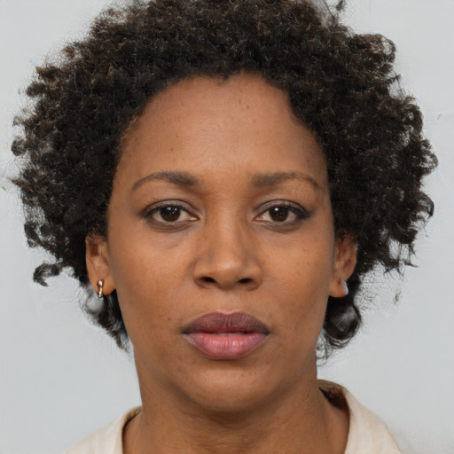 Neutral black adult female with short  brown hair and brown eyes