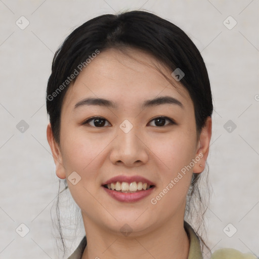 Joyful asian young-adult female with short  brown hair and brown eyes