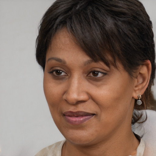 Joyful white adult female with short  brown hair and brown eyes