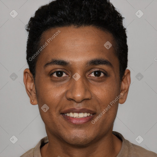 Joyful black young-adult male with short  black hair and brown eyes